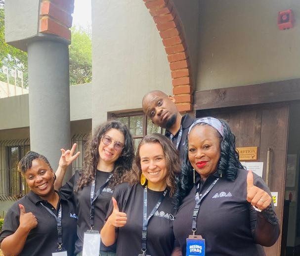 Ellen with coaches and Ministry of Education representatives from Zimbabwe, Botswana, and Eswatini